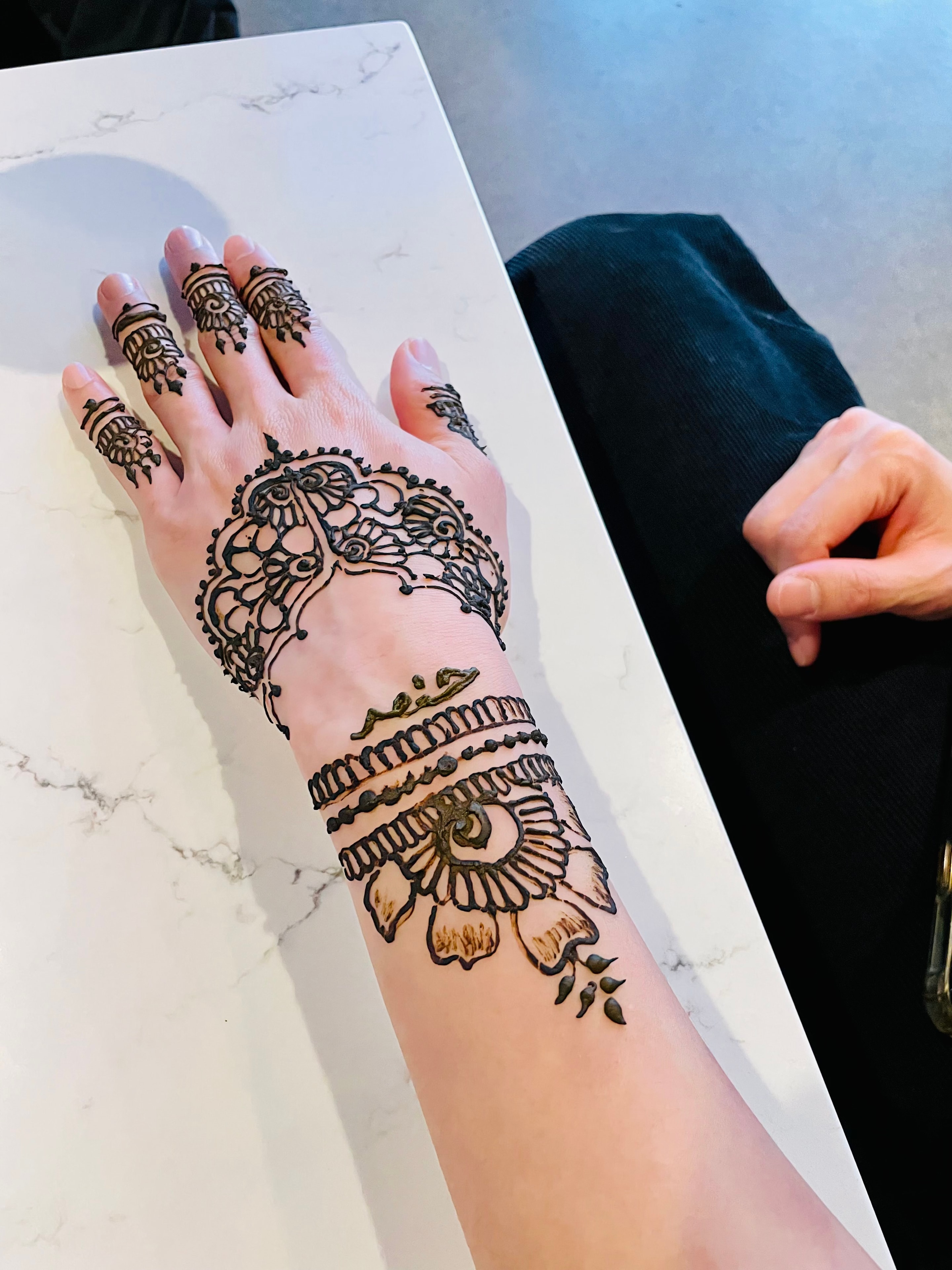 Open floral Arabic henna